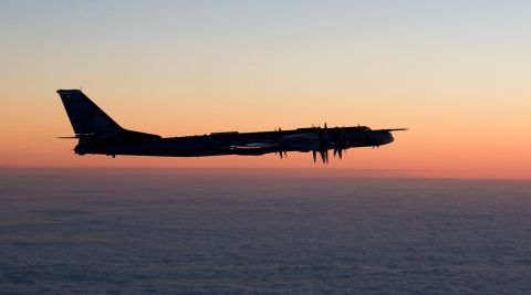 A Russian Tupolev Tu-95 Bear bomber intercepted by Finnish fighter planes.