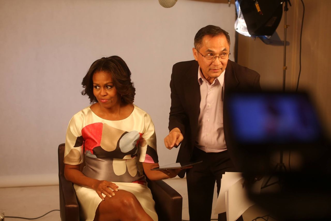 FlorCruz helps get First Lady Michelle Obama ready for an interview earlier this year. 