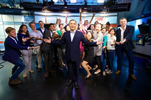 Jaime FlorCruz with friends and co-workers in CNN's Hong Kong newsroom on announcing his retirement. 