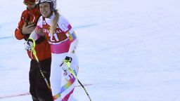 Lindsey Vonn is helped away by an official after her high speed crash in the super-G at Val d'isere.