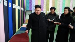This undated picture released from North Korea's official Korean Central News Agency (KCNA) on December 21, 2014 shows North Korean leader Kim Jong-Un (L) visiting the Kim Jong-Suk Pyongyang Textile Mill in Pyongyang.    AFP PHOTO / KCNA via KNS    REPUBLIC OF KOREA OUT 
THIS PICTURE WAS MADE AVAILABLE BY A THIRD PARTY. AFP CAN NOT INDEPENDENTLY VERIFY THE AUTHENTICITY, LOCATION, DATE AND CONTENT OF THIS IMAGE. THIS PHOTO IS DISTRIBUTED EXACTLY AS RECEIVED BY AFP. 
---EDITORS NOTE--- RESTRICTED TO EDITORIAL USE - MANDATORY CREDIT "AFP PHOTO / KCNA VIA KNS" - NO MARKETING NO ADVERTISING CAMPAIGNS - DISTRIBUTED AS A SERVICE TO CLIENTSKNS/AFP/Getty Images