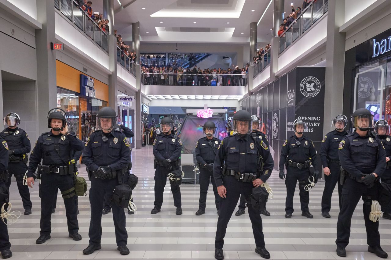Police line up to move the protesters from out of the mall on December 20 in Bloomington. 