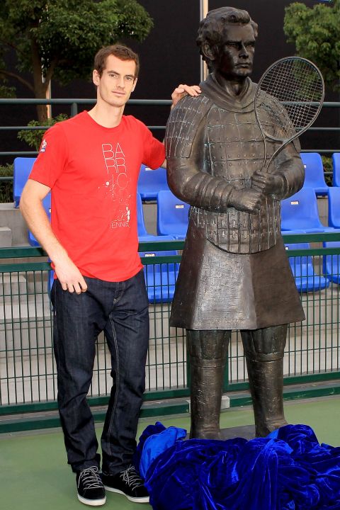 Andy Murray poses with a statue which is supposed to depict the tennis star as a Terracotta Warrior during the Shanghai Masters in 2011.