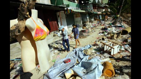 The 10th anniversary of the 2004 Indian Ocean earthquake and tsunami, which killed almost 250,000 people, will be remembered on December 26. Here, people walk through the streets of Tsunami-damaged Phi Phi Village on January 25, 2005, almost one month after the storm hit Ton Sai Bay in Kho Phi Phi, Thailand. 