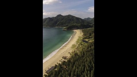 A recent aerial view of coastal Aceh shows the beach restored and trees regrown.