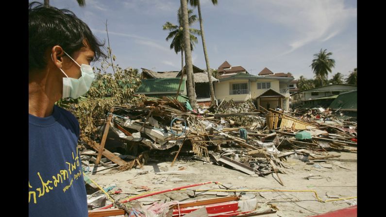 A Thai rescue worker looks at the destruction of hotels and shops on December 28, 2004, in Phi Phi Village.