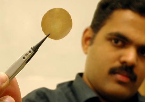 Researcher Dr. Rahul R. Nair shows his research sample: a one-micron thick graphene oxide film.