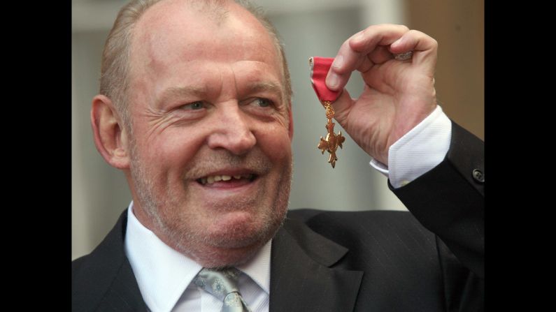 Cocker is pictured outside Buckingham Palace in 2007 after collecting his MBE (Member of the Order of the British Empire) for services to music. 