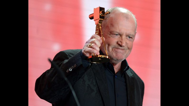 Cocker reacts after receiving a lifetime achievement award during the 48th Golden Camera awards ceremony in Berlin on February 2, 2013. 