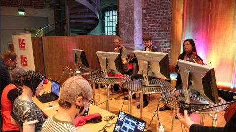 Miranda's latest composition is for a string quartet. It is an interaction between eight people, four of them generating music while the remaining four perform the composition as its being generated. Here, the professional string quartet get ready to play at the Music Tech Festival in September 2014.