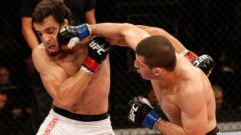 Rashid Magomedov of Russia, right, punches Elias Silverio of Brazil in their lightweight fight during the UFC Fight Night on December 20 in Brazil.