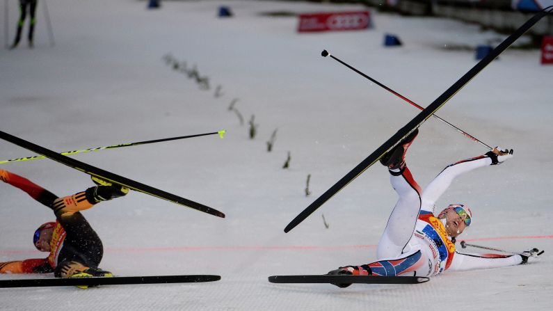 Fabian Riessle, left, of Germany and Joergen Graabak of Norway finish the team competition in the FIS Nordic Combined World Cup in Ramsau, Austria, on December 20.
