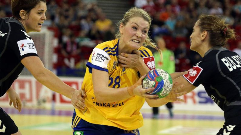 Montenegro's Marina Jovanovic, left, and Andjela Bulatovic, right, fight for the ball with Sweden's Ida Oden during the bronze medal match of the Women's European Handball Championship on December 21 in Budapest.