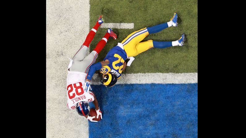 New York Giants wide receiver Rueben Randle dives across the end zone to score a touchdown against St. Louis Rams cornerback Trumaine Johnson on December 21 in St. Louis.