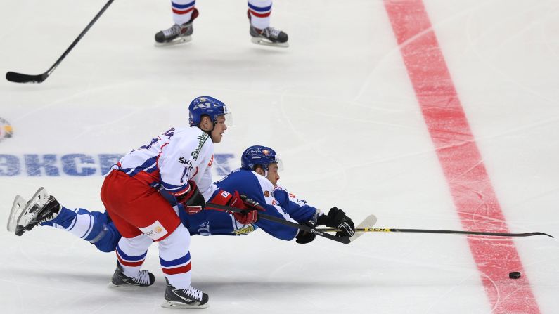 Czech Republic's Vladimir Sobotka, left, and Finland's Ilari Filppula fight for the puck in Sochi, Russia, on December 20. <a href="index.php?page=&url=http%3A%2F%2Fedition.cnn.com%2F2014%2F12%2F16%2Fworldsport%2Fgallery%2Fwhat-a-shot-1216%2F">See 31 amazing sports photos from last week.</a>