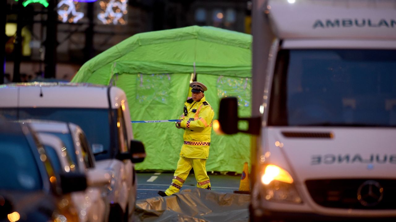 Emergency services attend the scene of the crash in George Square on December 22, 2014 in Glasgow, Scotland