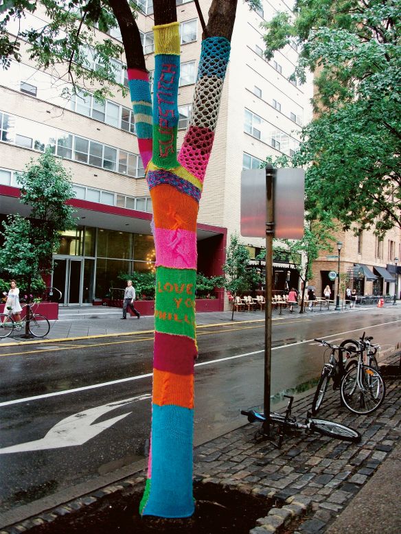 <strong>Ishknits</strong><br />"<em>Tree</em>," Rittenhouse Square, Philadelphia, 2010, yarn. © <a href="https://www.cnn.com/travel/gallery/street-art-beyond-graffiti/www.streetsdept.com" target="_blank">Conrad Benner,</a> <br /><br />Californian-based Ishknits wraps relics of the past in yarn to draw fresh attention to them. Payphones are "yarn-bombed" and former Philadelphia mayor Frank Rizzo is dressed in a pink bikini. Many of her past works have taken over statues and monuments in her former hometown, Philadelphia, to make frequently funny statements about masculinity and femininity. 