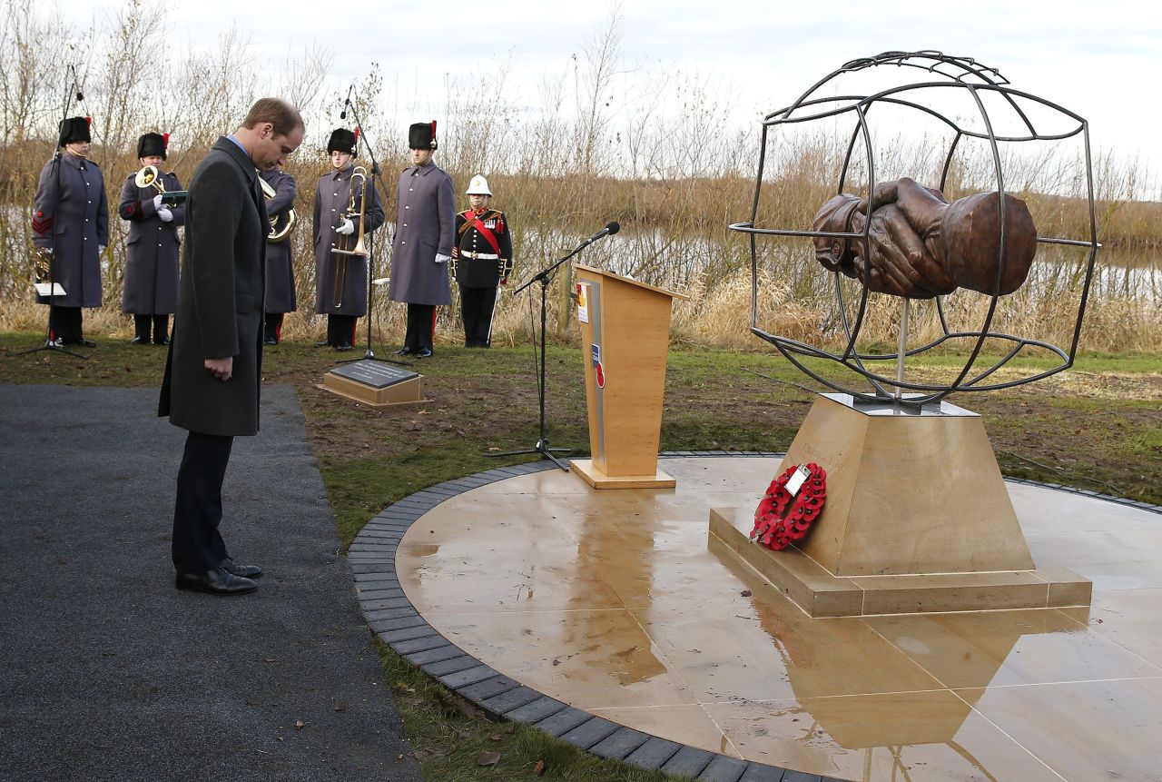 Prince William takes a moment to remember those who fought in WWI in front of the memorial designed by 10 year-old Spencer Turner from Newcastle. 