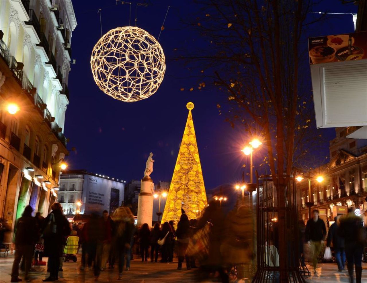 Bright Christmas decor adorns Puerto del Sol, a bustling square in <a href="http://ireport.cnn.com/docs/DOC-1069767">Madrid, Spain</a>.