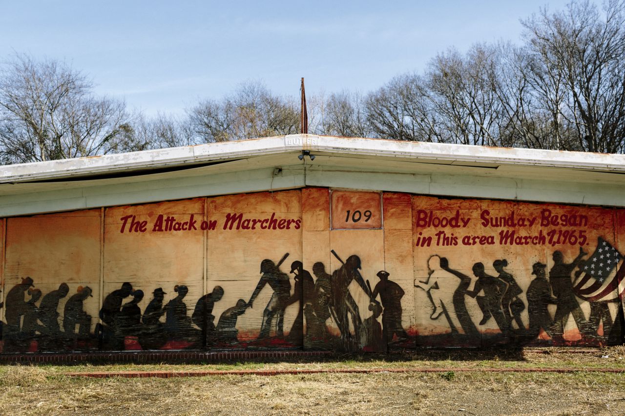 A mural on a building at the foot of the Edmund Pettus Bridge commemorates Bloody Sunday. Some scenes for the movie "Selma" were filmed near this building.