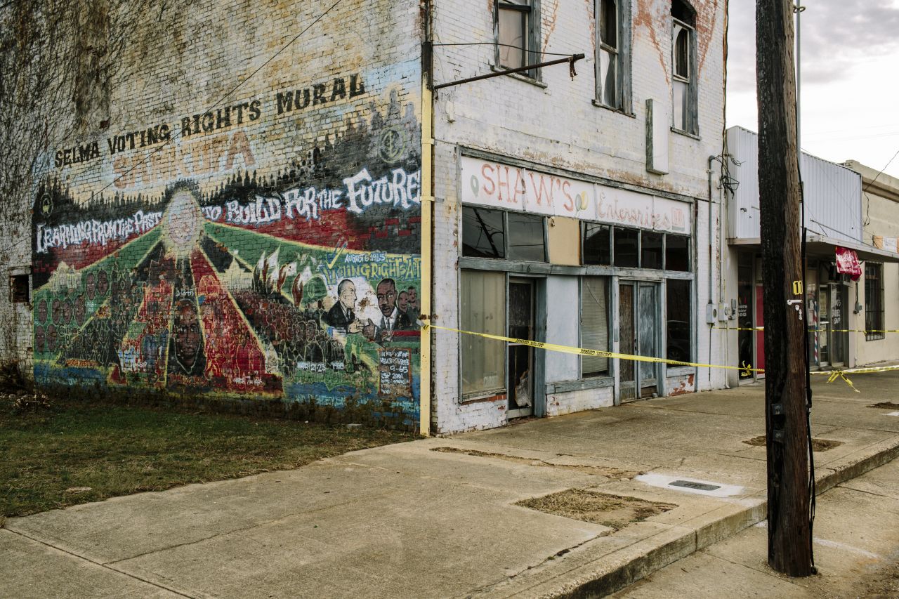 A civil rights mural decorates the side of a dilapidated building in downtown Selma. Nearly 42% of the city's population lives under the federal poverty line.