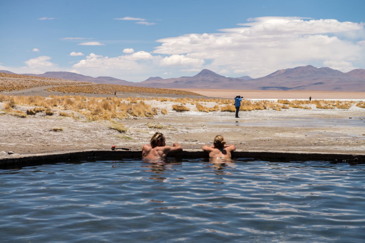 In icy winds at more than 13,700 feet above sea level, the 96 F (35.5 C) Termas de Polques hot springs provide a warm refuge for dusty travelers. 