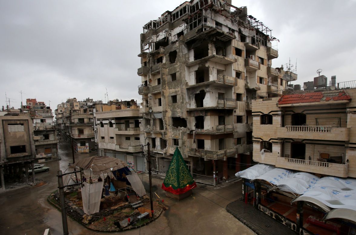 A Christmas tree and a crèche made out of rubble are set up on a square in the, predominantly Christian, government-held Hamidiyeh neighborhood of Homs on Monday, December 22.