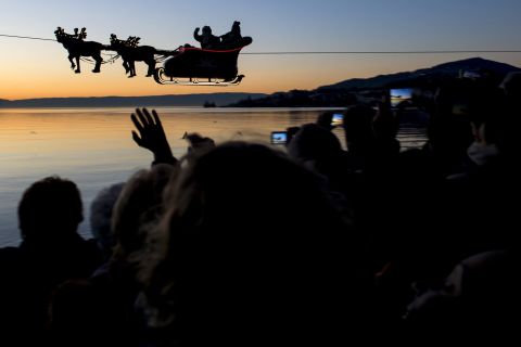With help from a cable, Santa and his reindeer "fly" over Lake Geneva as part of the Christmas Market in Montreux, Switzerland.