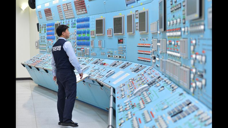 In this photo provided by the Korea Hydro & Nuclear Power Co., workers participate in an anti-cyberattack exercise at Wolsong power plant on Monday, December 22, in Gyeongju, South Korea.