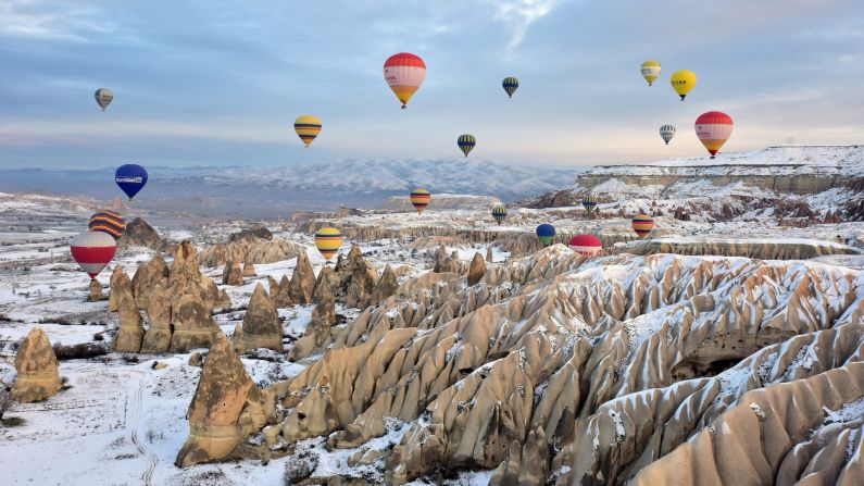 Hot-air balloons fly over Cappadocia, a historical region in Turkey's Central Anatolia, on Tuesday, December 23.