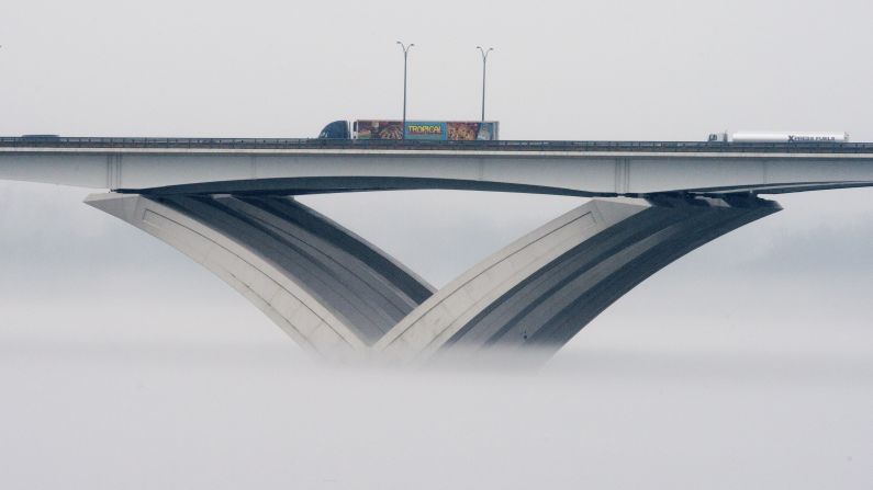 Fog spreads over the Potomac River in Alexandria,Virginia, at the Woodrow Wilson Bridge on Wednesday, December 24.