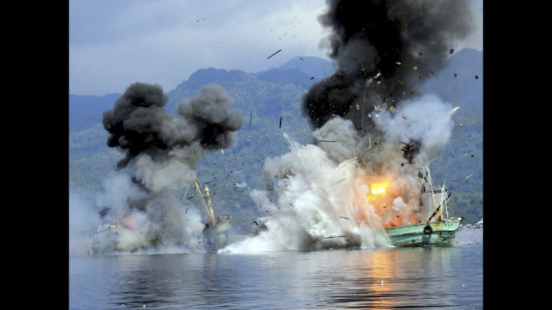 Two fishing boats registered in Papua New Guinea are destroyed by the Indonesian navy after they were seized for alleged illegal fishing on Sunday, December 21.