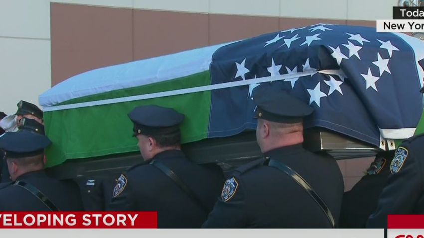 Officers carry casket of slain cop | CNN