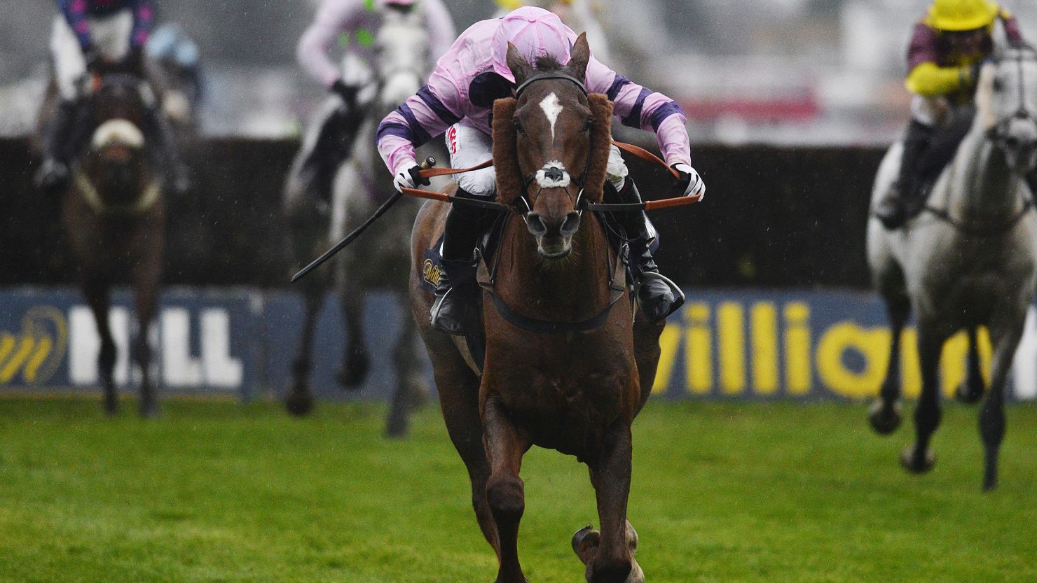 Silviniaco Conti powers clear of the field under jockey Noel Fehily to win the King George VI at Kempton Park.