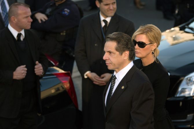 New York Gov. Andrew Cuomo arrives at the funeral with his girlfriend Sandra Lee.