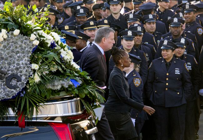 New York City Mayor Bill de Blasio and his wife, Chirlane McCray, arrive for the funeral.