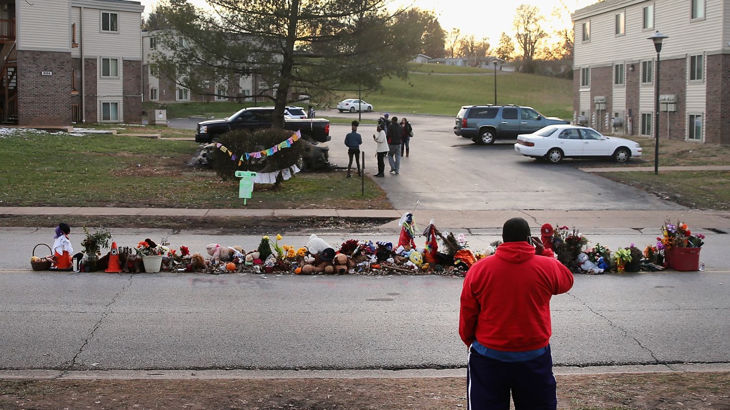 Visitors look at the Michael Brown memorial in Ferguson, Missouri, on November 28.