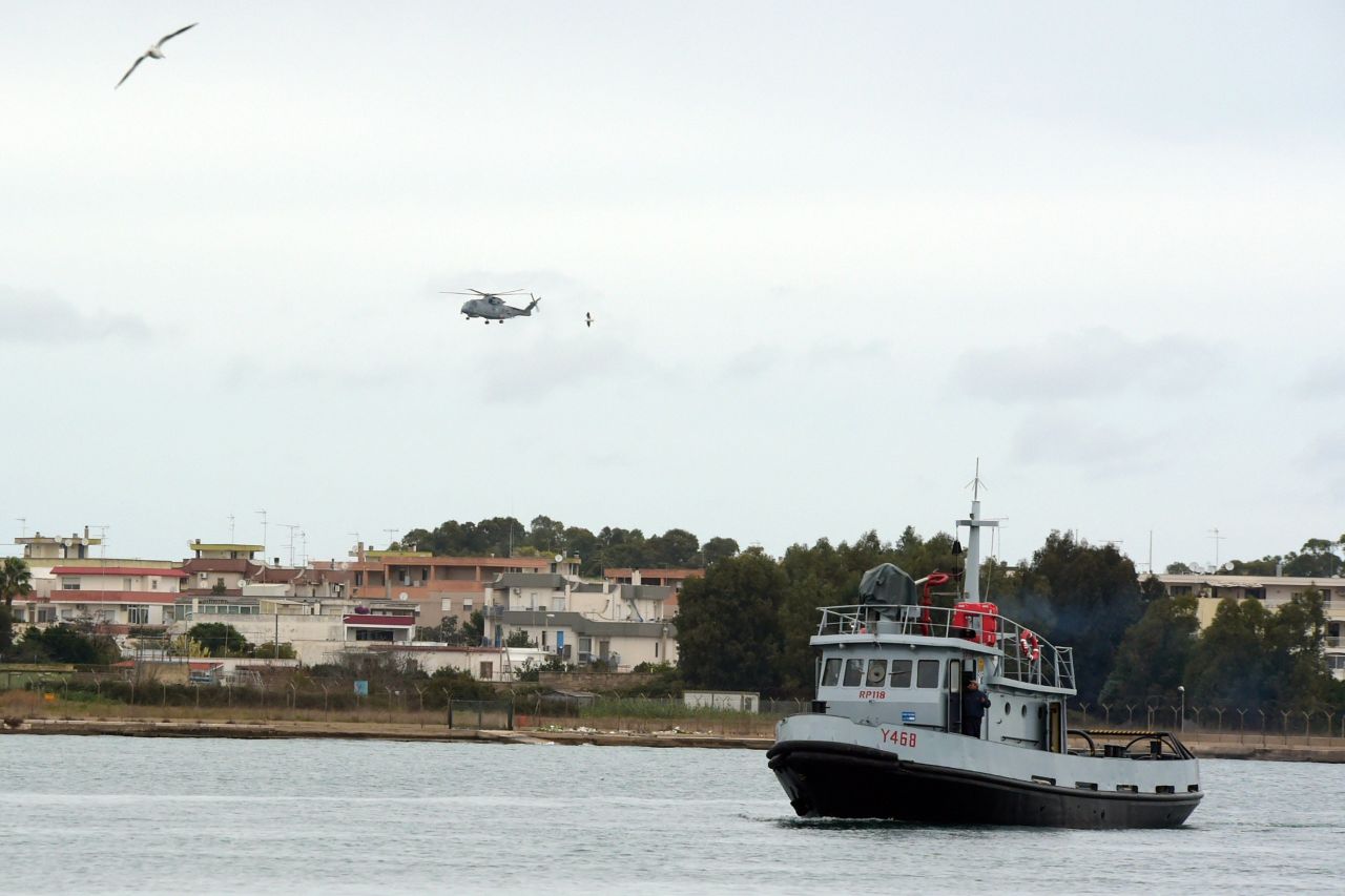 An Italian Navy helicopter and a rescue unit leave the port of Brindisi to take part in the rescue operations.