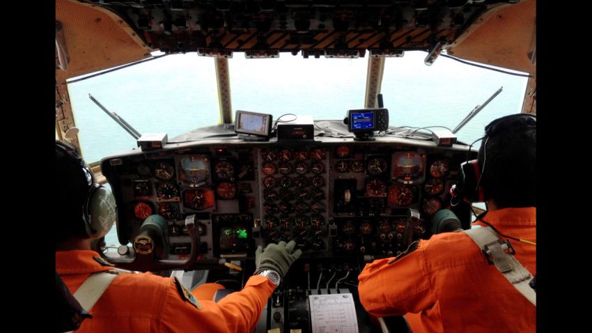 Image #: 33967831 JAKARTA, INDONESIA - DECEMBER 28: Military personnels seen aboard Hercules military aircraft, during a search operation from Halim Perdana Kusuma Airport, to the point where AirAsia flight lost its contact with Air Asia Surabaya-Singapore route on December 28, 2014 in Jakarta, Indonesia. AirAsia flight QZ8501, flying from Indonesia to Singapore with 162 people on board is missing on December 28. Agoes Rudianto/Barcroft Media /Landov