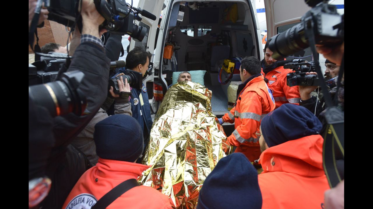 A passenger of the Norman Atlantic is carried on a stretcher in Bari harbor in Italy on Monday, December 29. The ferry, carrying hundreds of passengers, caught fire early Sunday, trapping passengers on the top decks as gale-force winds and choppy seas hampered the evacuation.
