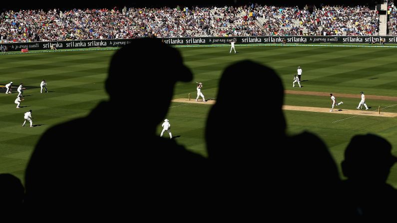 Cricket fans in Melbourne watch Australia's Brad Haddin bat against India on Friday, December 26.