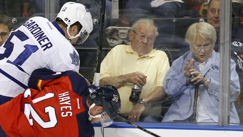 Fans react as Florida Panthers right wing Jimmy Hayes checks Toronto's Jake Gardiner into the boards during an NHL hockey game played Sunday, December 28, in Sunrise, Florida.