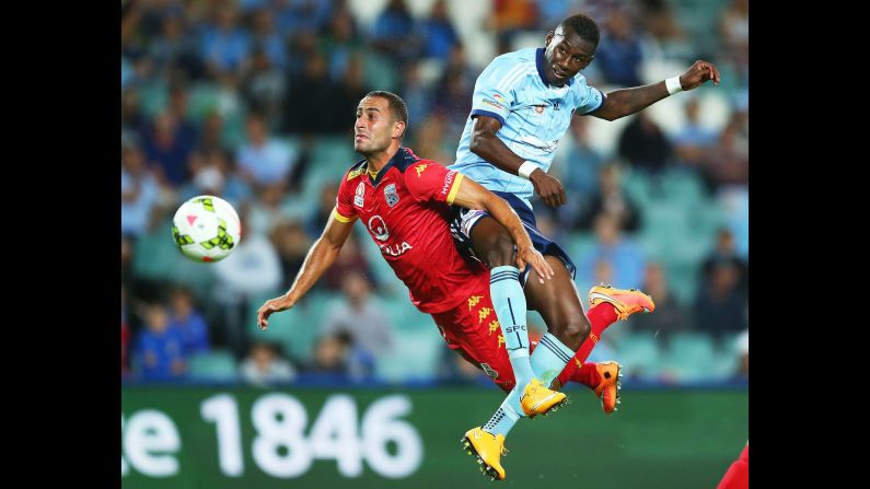 Tarek Elrich of Adelaide United, left, competes with Bernie Ibini of Sydney FC during an A-League match in Sydney on Friday, December 26.