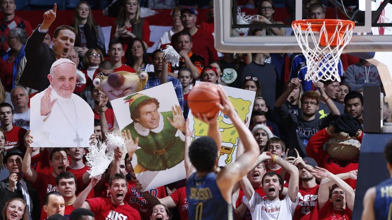 Fans of the Dayton Flyers try to distract Georgia Tech's Tadric Jackson as he takes a free throw Tuesday, December 23, in Dayton, Ohio.