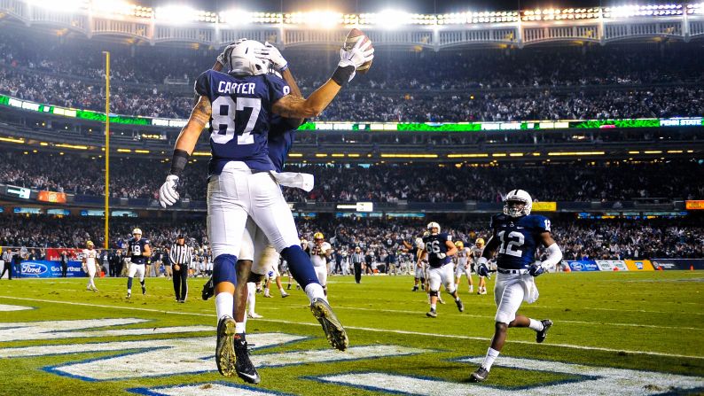 Penn State's Kyle Carter celebrates after catching a touchdown during the Pinstripe Bowl, which was played Saturday, December 27, at New York's Yankee Stadium. Carter's score came in overtime as the Nittany Lions defeated Boston College 31-30.