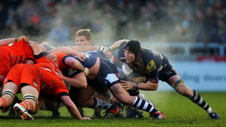 Magnus Lund of the Sale Sharks, right, waits for the ball to emerge from a scrum during a Premiership match between Sale and the Leicester Tigers played Saturday, December 27, in Salford, England.