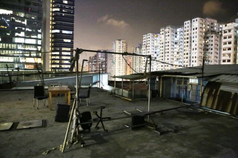 This rooftop dwelling in Kwun Tong accommodates around 40 people. Residents often use this open area for gatherings or to air-dry their laundry.