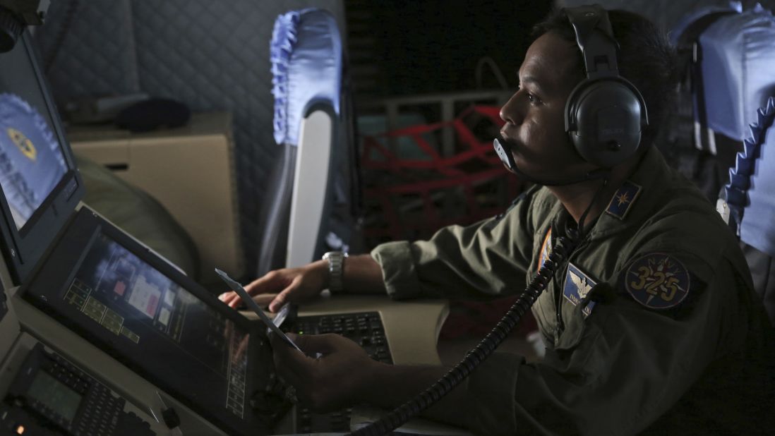 A member of the Indonesian navy monitors a radar screen during a search operation over the waters near Bangka Island, Indonesia, on December 30.