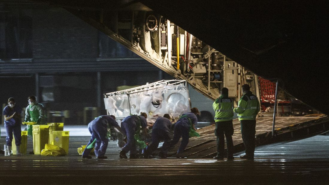 Pauline Cafferkey, a Scottish woman diagnosed with Ebola, is put on a plane in Glasgow, Scotland, on December 30, 2014. Cafferkey, a 39-year-old nurse who volunteered in Sierra Leone, <a href="http://www.cnn.com/2014/12/31/world/europe/uk-ebola/index.html" target="_blank">was being transported to London</a> for treatment.