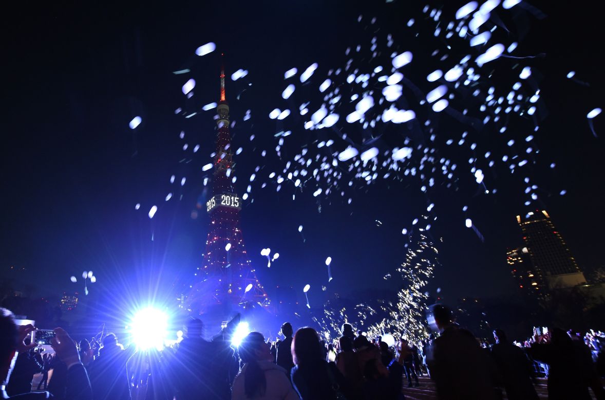People release balloons beside the Tokyo Tower to celebrate the new year in Japan's capital.